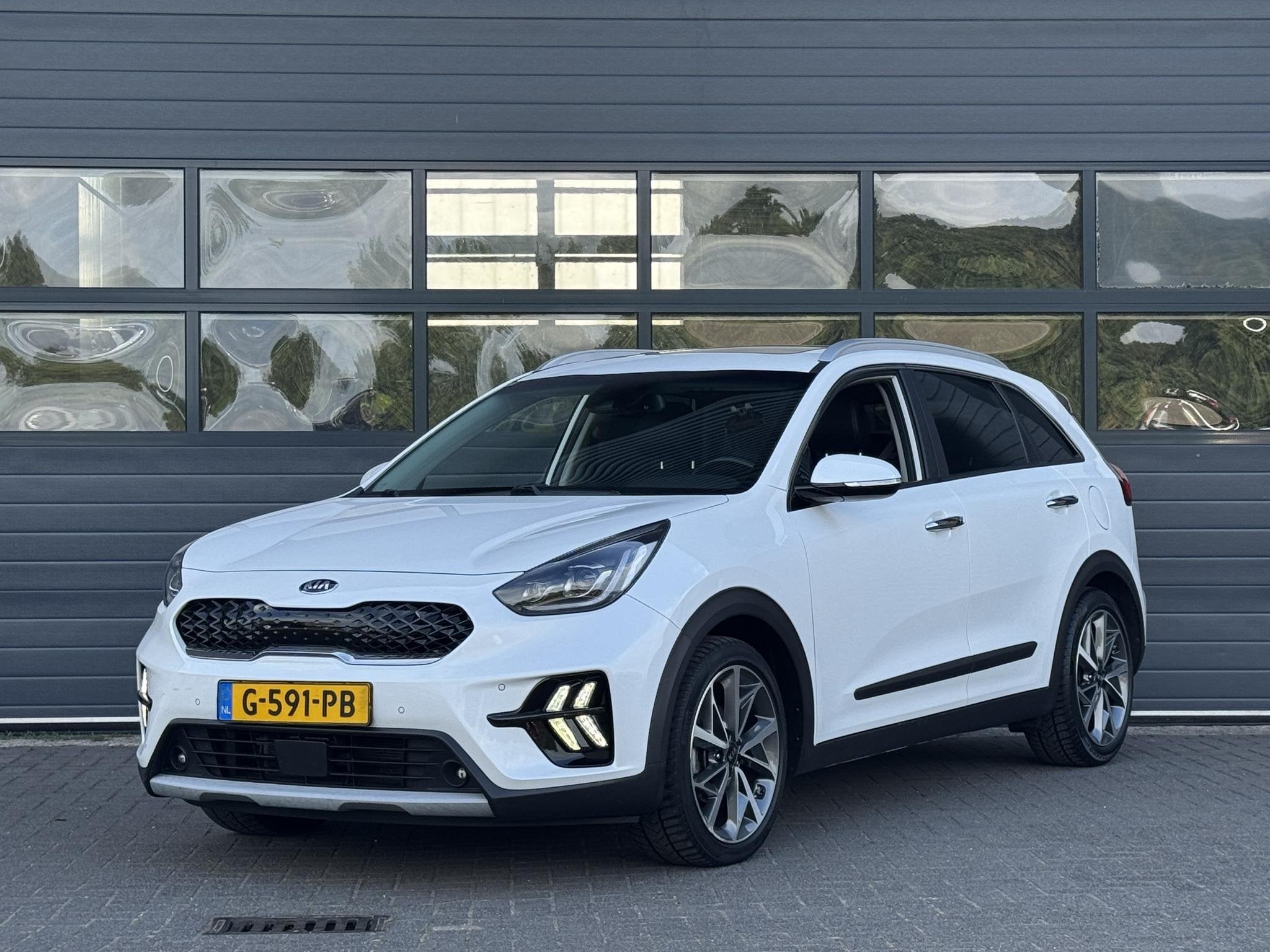 KIA NIRO 1.6 GDi HYBRID EXECUTIVELINE I AUTOMAAT I TREKHAAK, Auto's, Kia, Gebruikt, Lichtsensor, 1390 kg, SUV of Terreinwagen