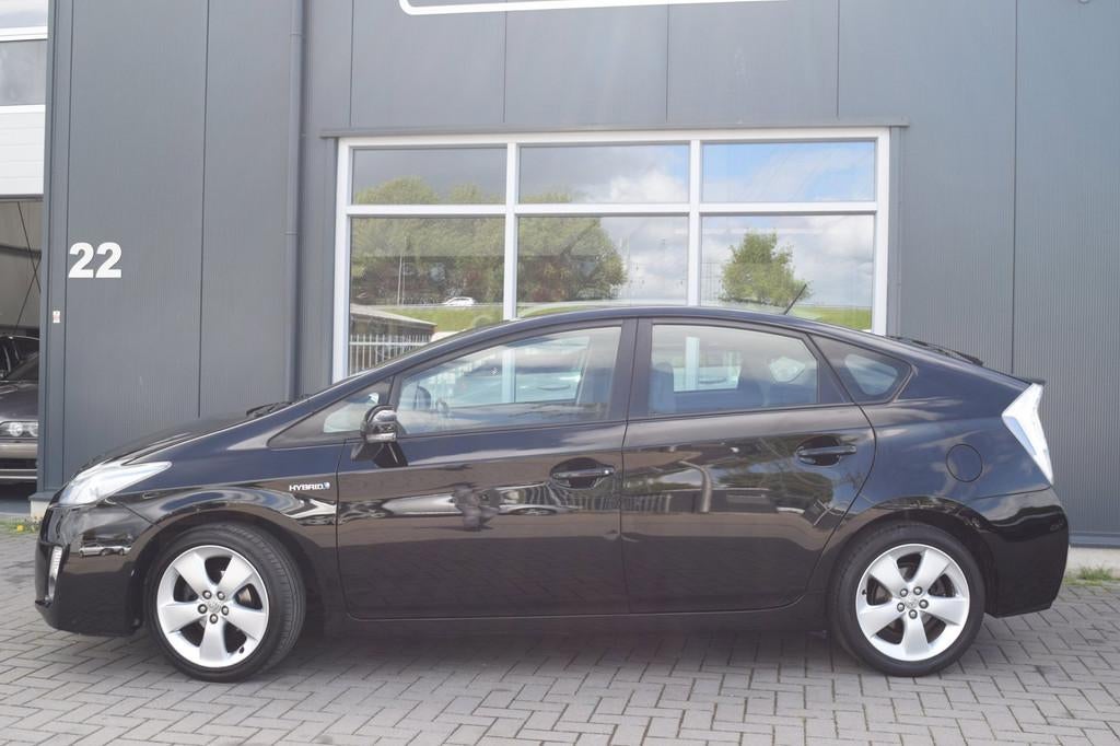 Toyota Prius 1.8 Aspiration | Clima | Cruise | NAP + APK 5-2, Stof, Gebruikt, Zwart, 4 cilinders