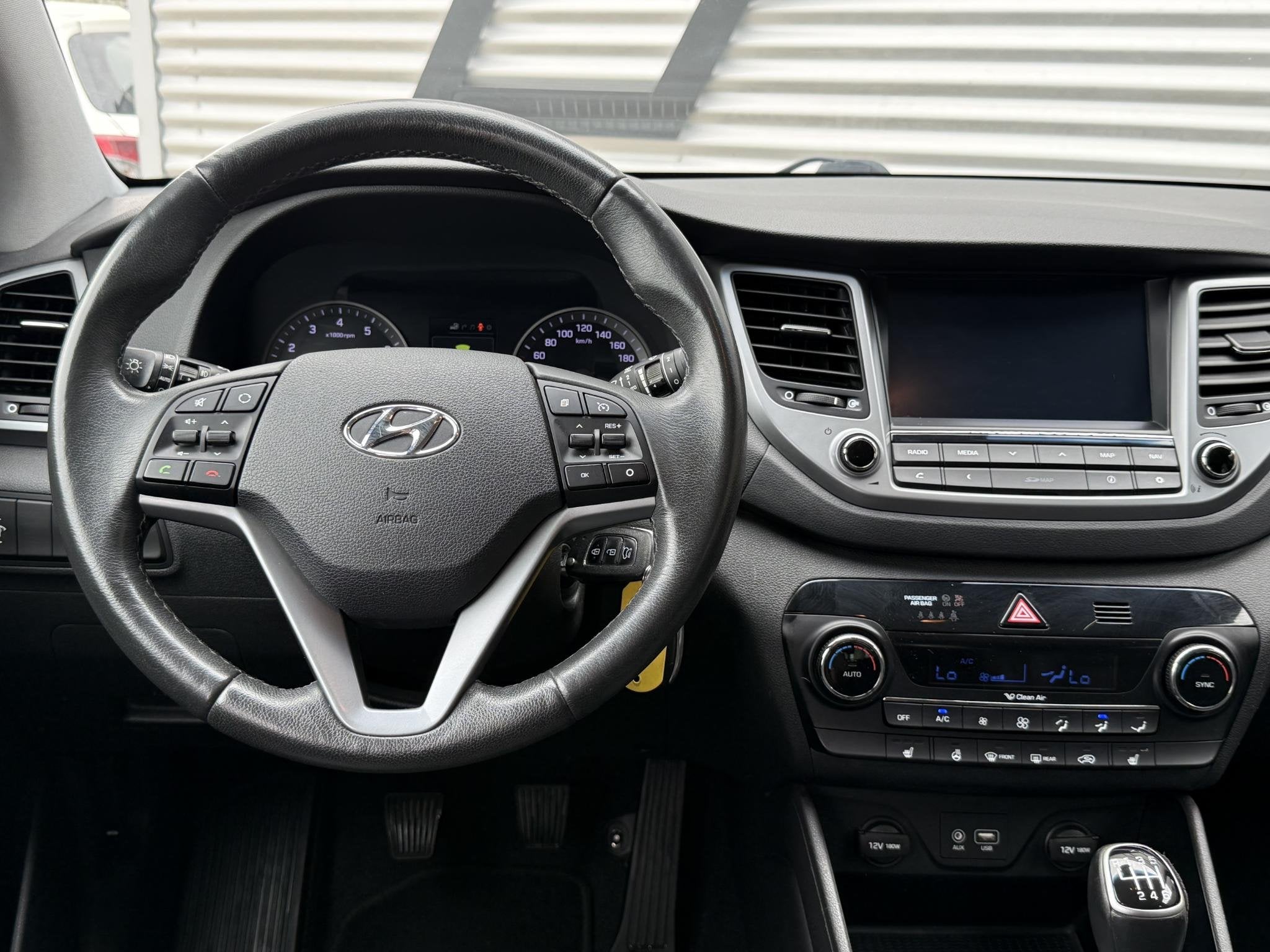 Hyundai Tucson 1.6 GDi Comfort 1e Eigenaar|Navi|Camera|Clima, Auto's, Voorwielaandrijving, Gebruikt, 4 cilinders, 132 pk
