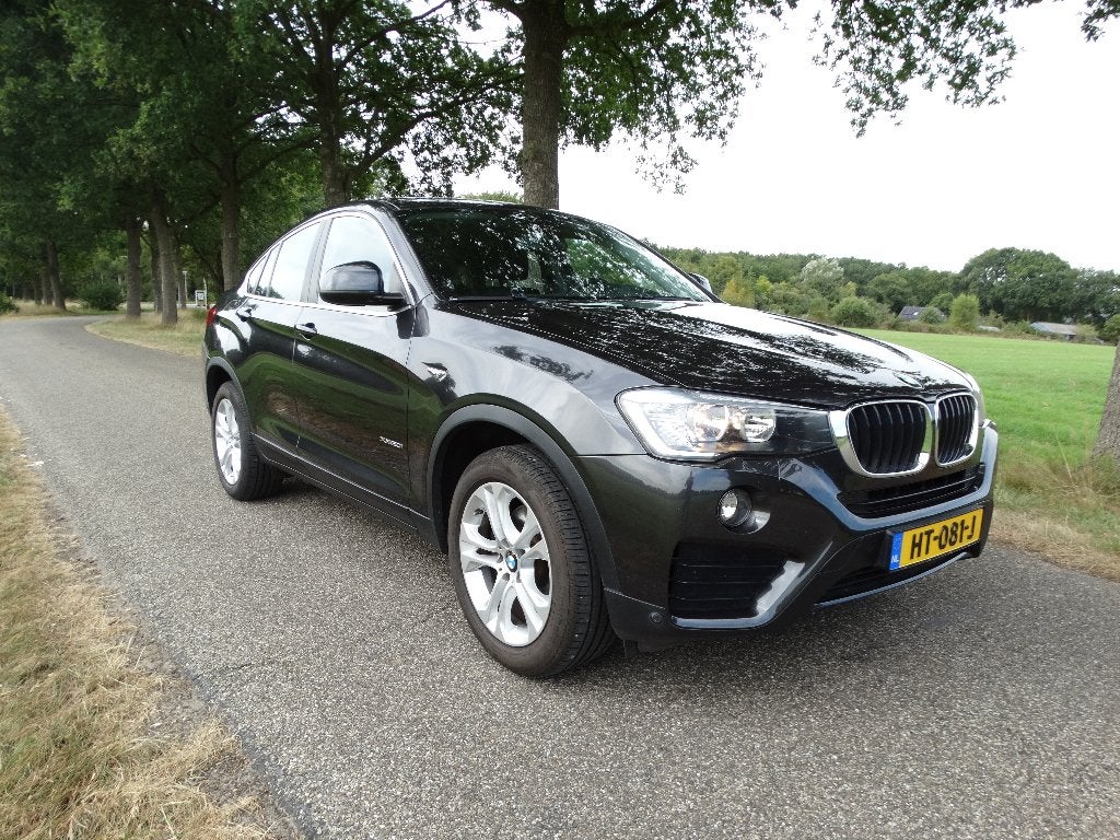 BMW X4 2.0 Xdrive High Excutieve NL auto, Auto's, BMW, Zwart, 4 cilinders, Zwart, X4