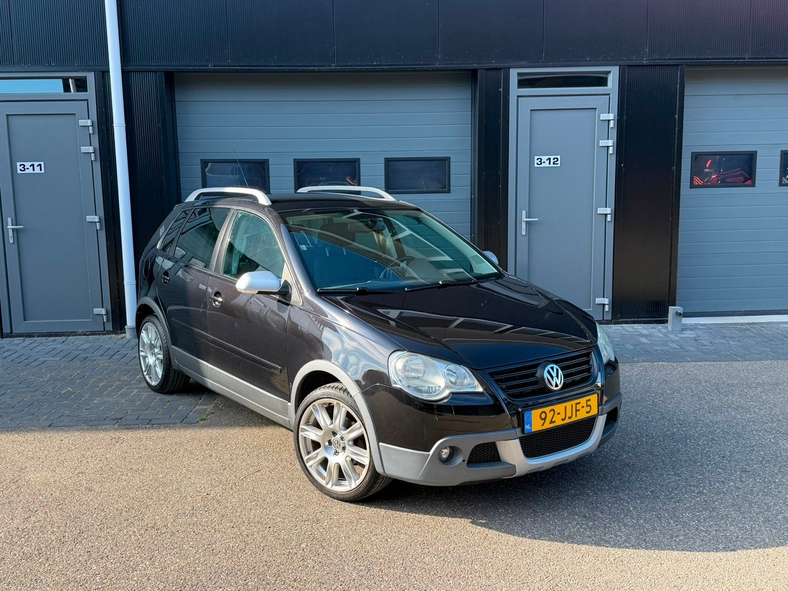 Volkswagen Polo 1.4 16V 59KW Cross 2009 Zwart, Auto's, Volkswagen, Voorwielaandrijving, 15 km/l, Zwart, Origineel Nederlands