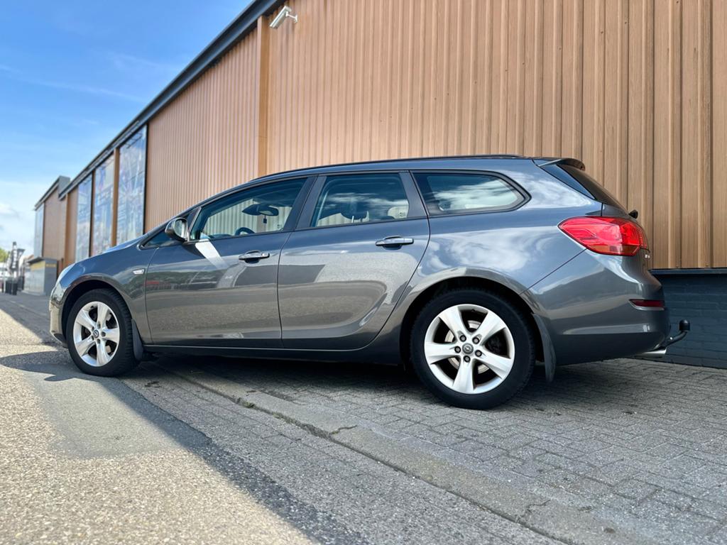 Opel Astra 1.6 Turbo 180PK 132KW Sports Tourer 2011 Grijs, Auto's, Voorwielaandrijving, Parkeersensor, Zwart, 4 cilinders
