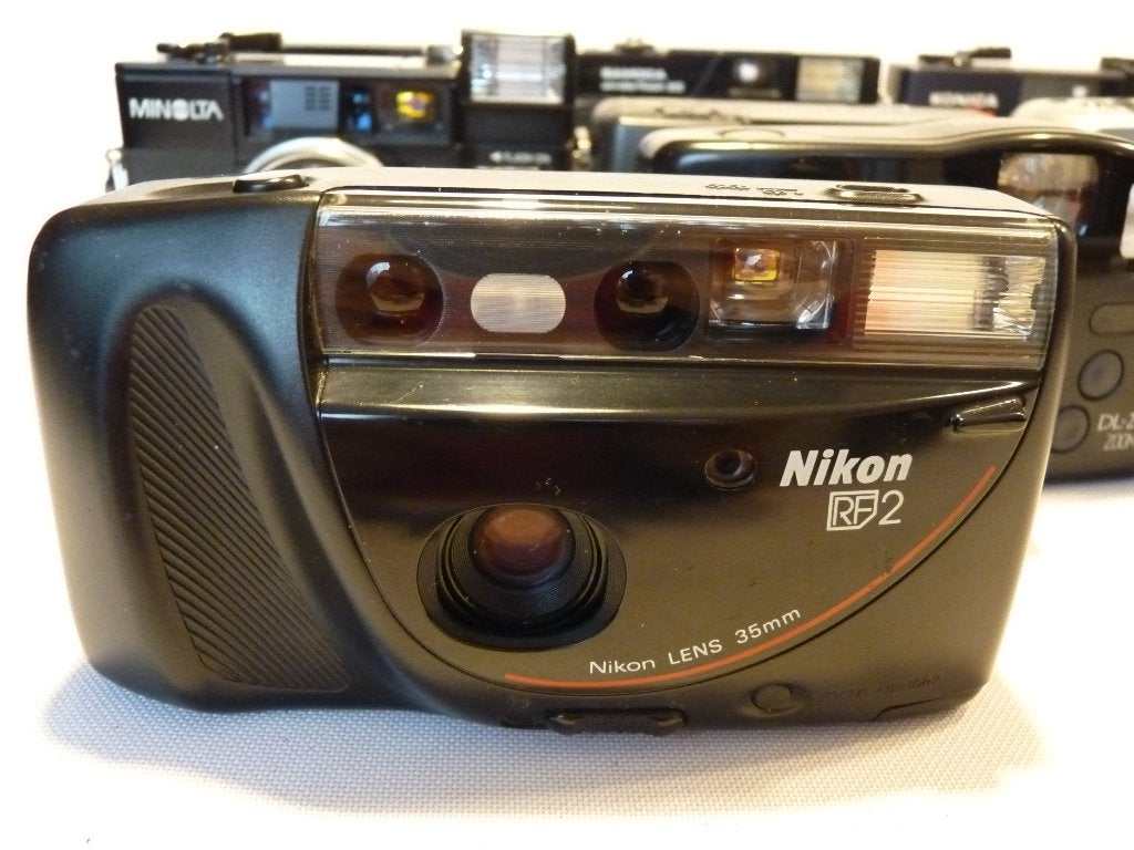 9 analoge camera’s: Nikon, Fuji, Minolta,Pentax,Konica,Braun, Ophalen of Verzenden, Zo goed als nieuw, Compact, Nikon