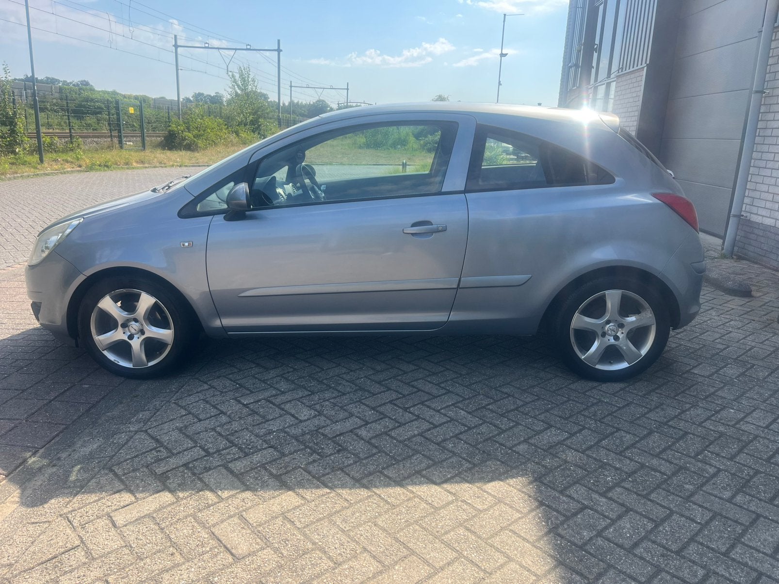 Opel Corsa 1.2 16V 3D WR 2007 Grijs NIEUWE APK, Auto's, Opel, Voorwielaandrijving, 40 €/maand, Zwart, 4 cilinders