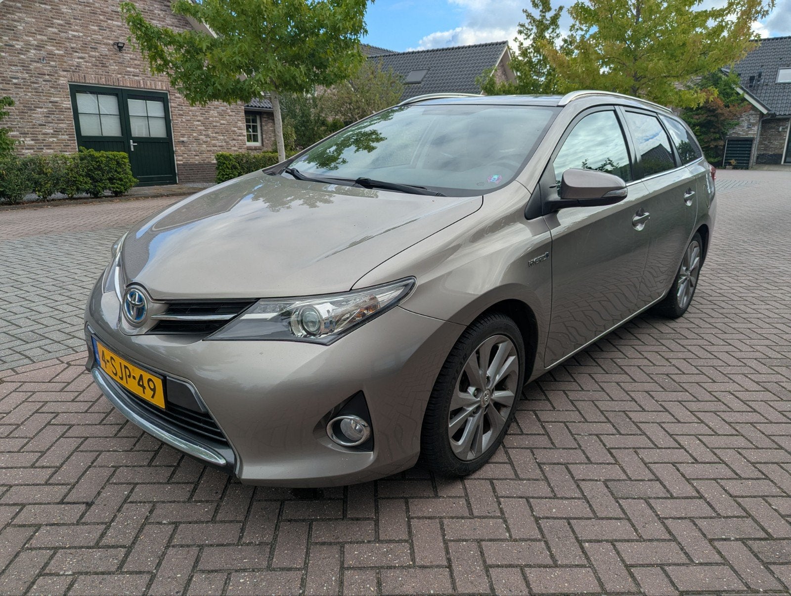 Te koop nette Toyota Auris 1.8 Hybrid Touring Sports CVT 201, Auto's, Toyota, Stof, Zwart, Bruin, Origineel Nederlands