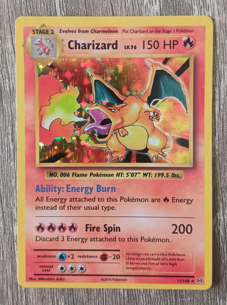 Charizard holo Evolutions, Ophalen of Verzenden, Zo goed als nieuw, Losse kaart, Foil