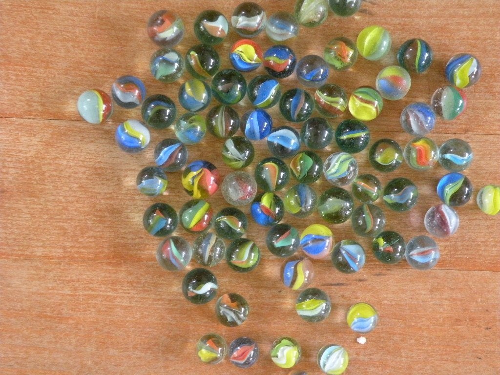 Knikkers, doorzichtig glas met 3 kleurtjes erin., Ophalen of Verzenden, Zo goed als nieuw