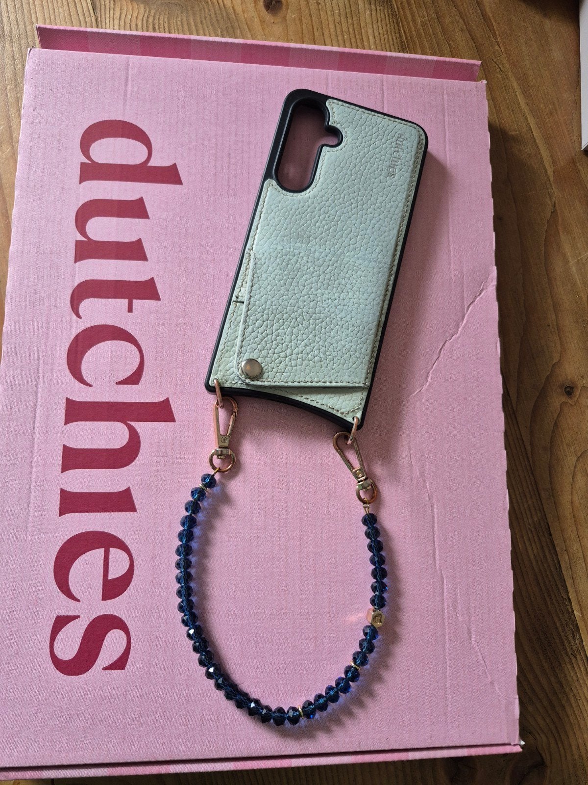 Dutchies Samsung S24FE telefoonhoesje met kralenketting, Ophalen of Verzenden, Gebruikt, Camerabeschermer