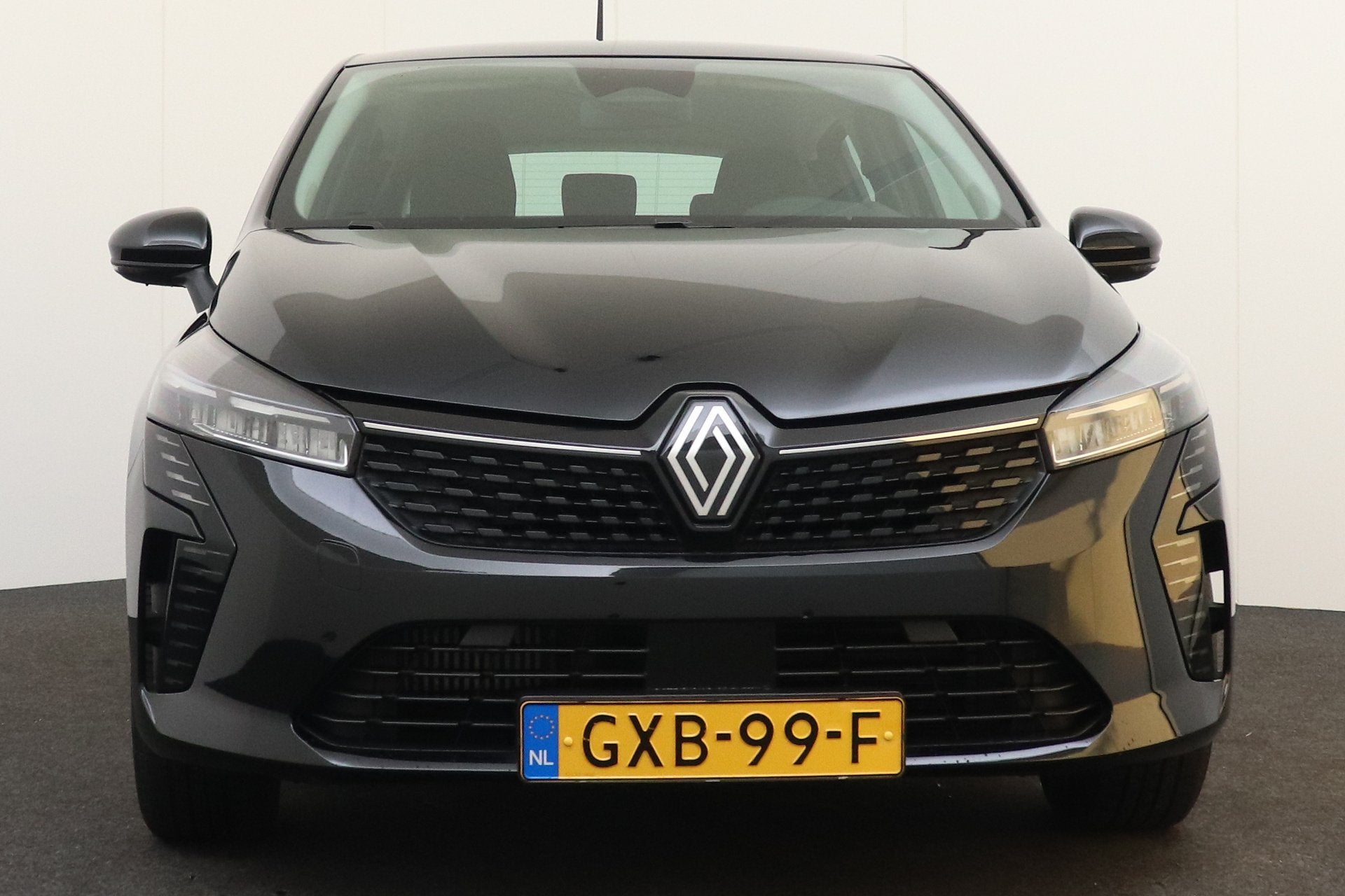 Renault Clio 1.0 TCe 92 PK Evolution Half-Leder/Sportstoelen, Auto's, Voorwielaandrijving, Gebruikt, Leder en Stof, Zwart