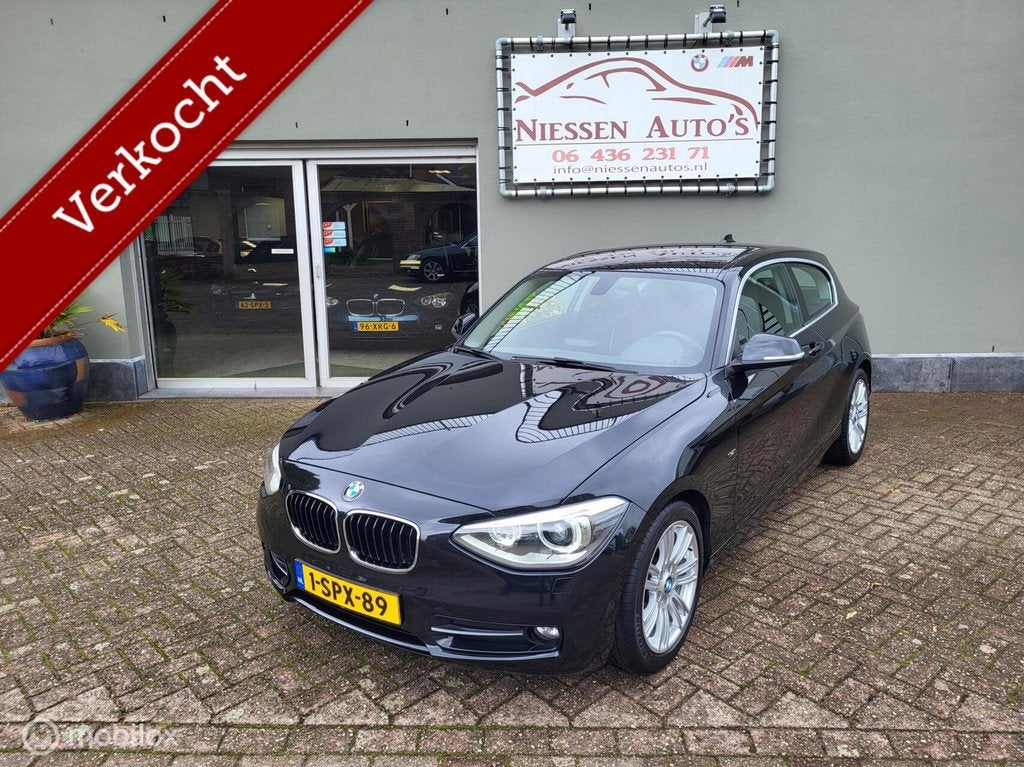 BMW 1-serie 116i EDE Sport Navi/Xenon/Trekhaak Ketting V.V, Auto's, 1-Serie, 4 cilinders, Zwart, Origineel Nederlands