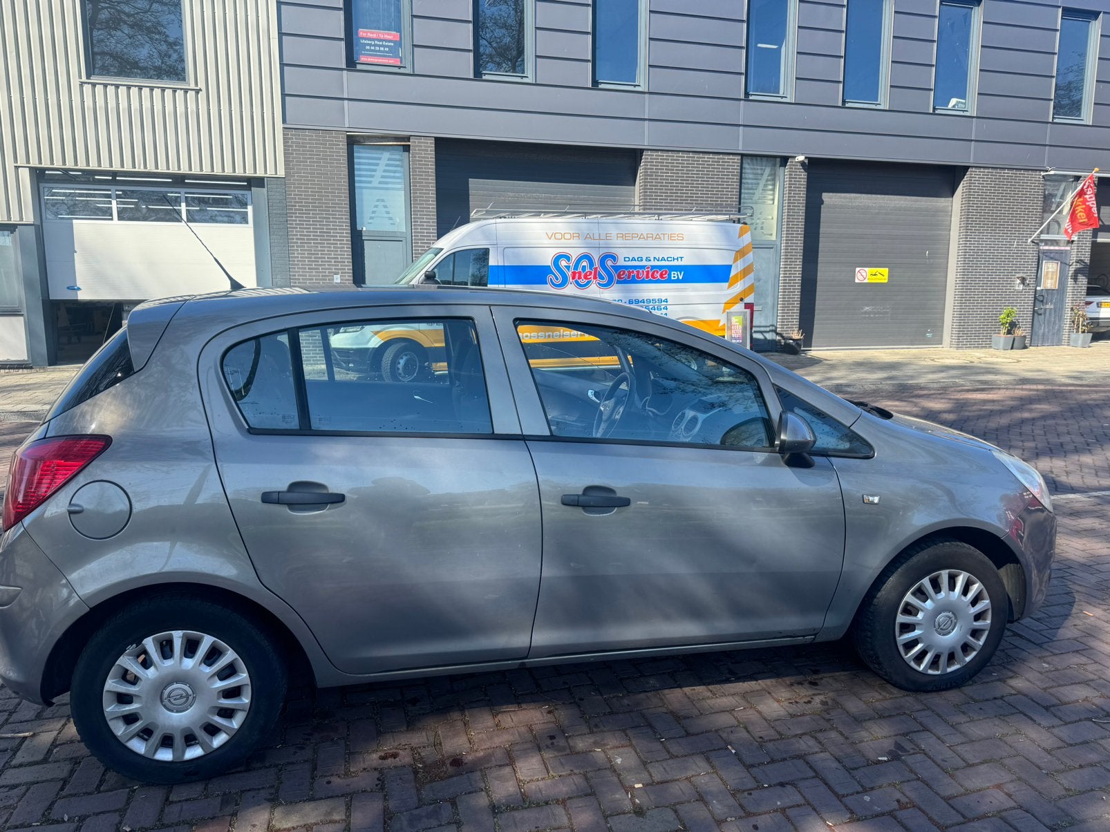 Opel Corsa 1.2 16V 5D 2010 Bruin, Auto's, Opel, Voorwielaandrijving, 4 cilinders, Bruin, 1229 cc