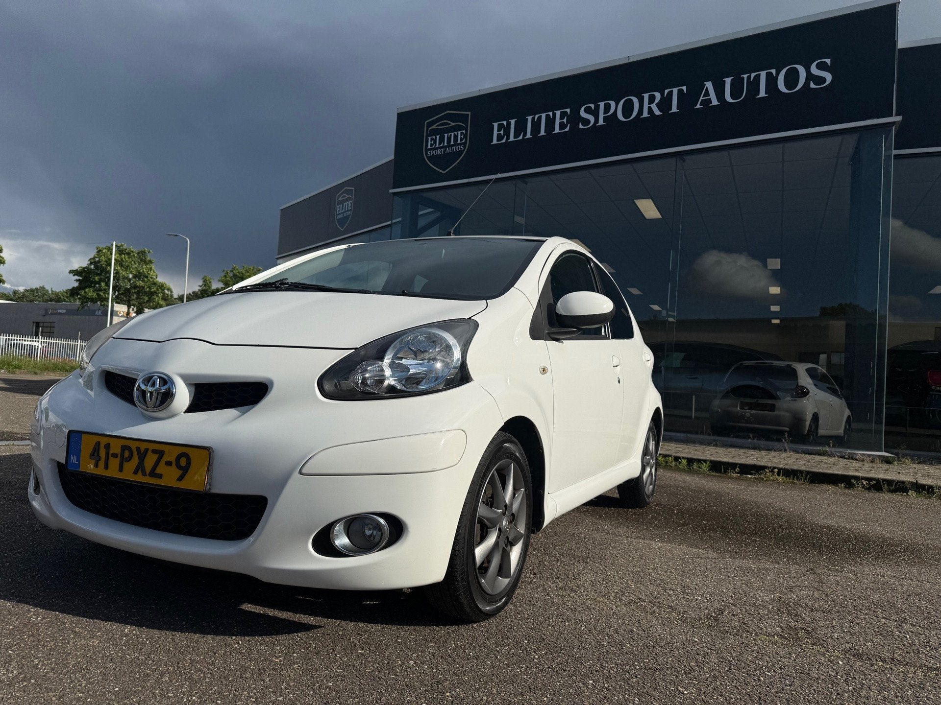 Toyota Aygo 1.0-12V Dynamic Navigator I Airco I Navigatie I, Auto's, Voorwielaandrijving, Euro 5, Stof, Gebruikt