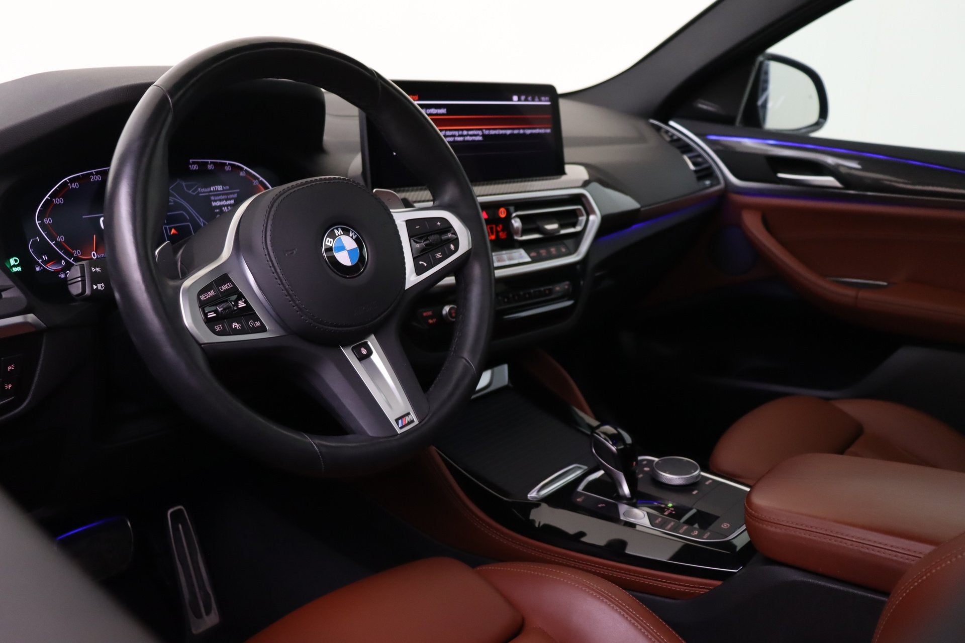 BMW X4 xDrive20i High Executive M Sport Automaat / Panoramad, Auto's, Gebruikt, 4 cilinders, Met garantie (alle), Blauw