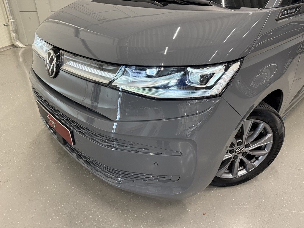 Volkswagen Multivan 1.4 eHybrid EDITION 7p. PANO/HEAD-UP/LEE, Auto's, Gebruikt, Zwart, Met garantie (alle), 7 stoelen