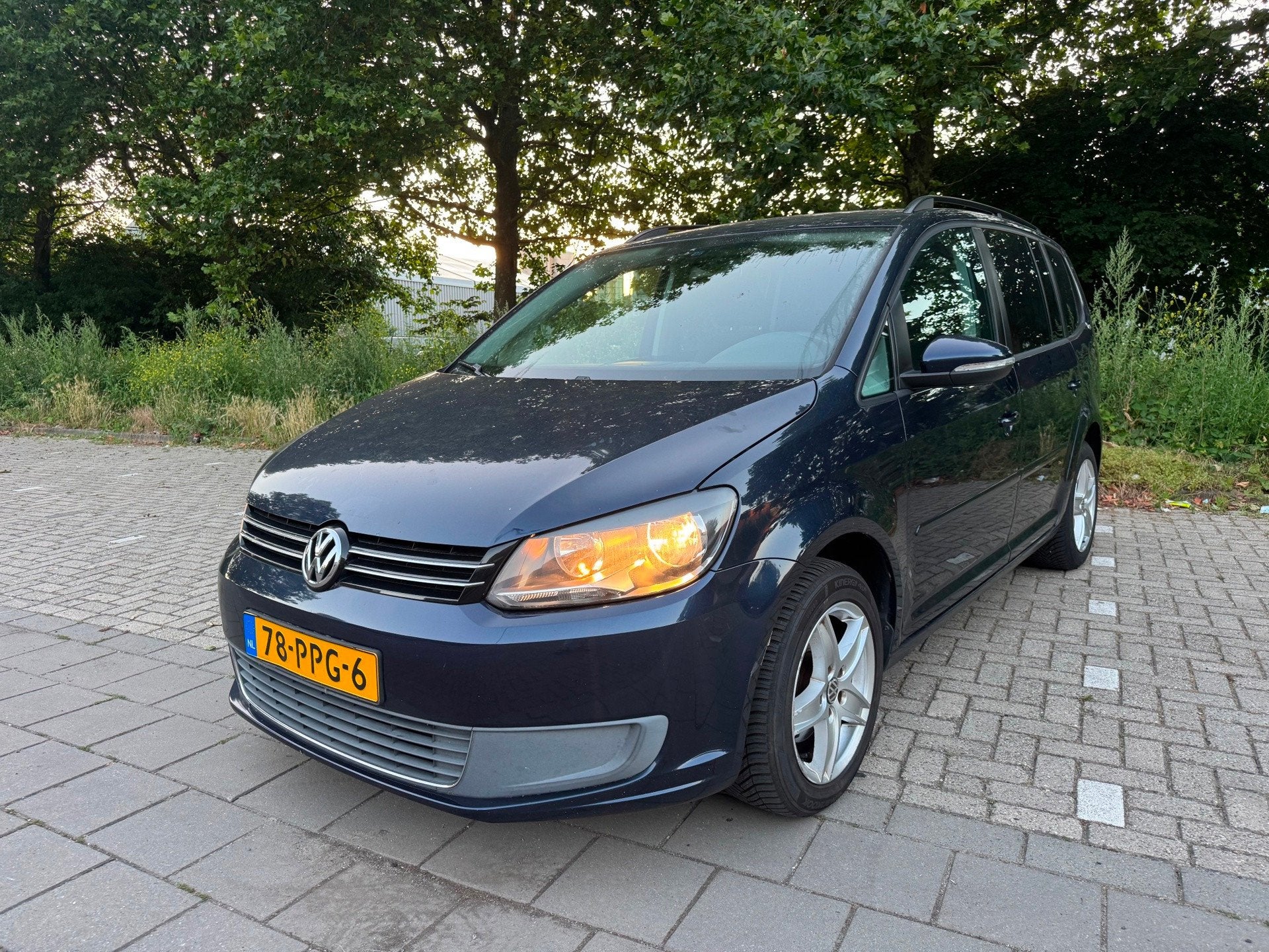 Volkswagen Touran 1.2 TSI Comfortline BlueMotion, Auto's, Euro 5, 730 kg, Gebruikt, Blauw