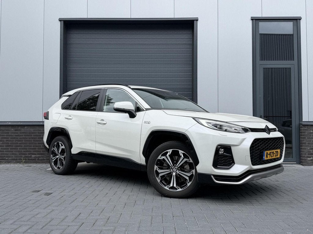 Toyota RAV-4 Plug-in Hybrid Style AWD, Auto's, Toyota, Automaat, Gebruikt, 2487 cc, Leder en Stof