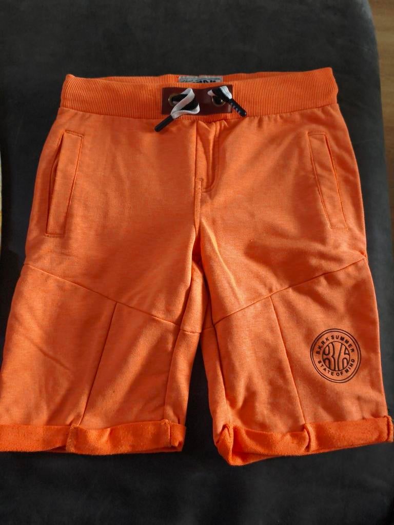 Oranje korte broek Skurk maat 122/128, Kinderen en Baby's, Ophalen of Verzenden