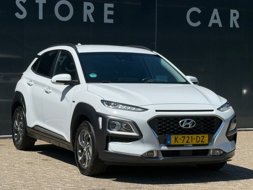 Hyundai Kona 1.6 GDI HEV Fashion Navi|Carplay|Stoelver|Dodeh, Auto's, Hyundai, Stof, Gebruikt, Automatische klimaatregeling, Wit