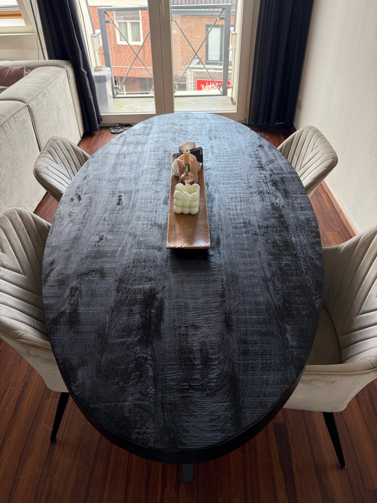 Ovale eettafel van zwart hout met metalen poten, Ophalen, 100 tot 150 cm, Zo goed als nieuw, 150 tot 200 cm