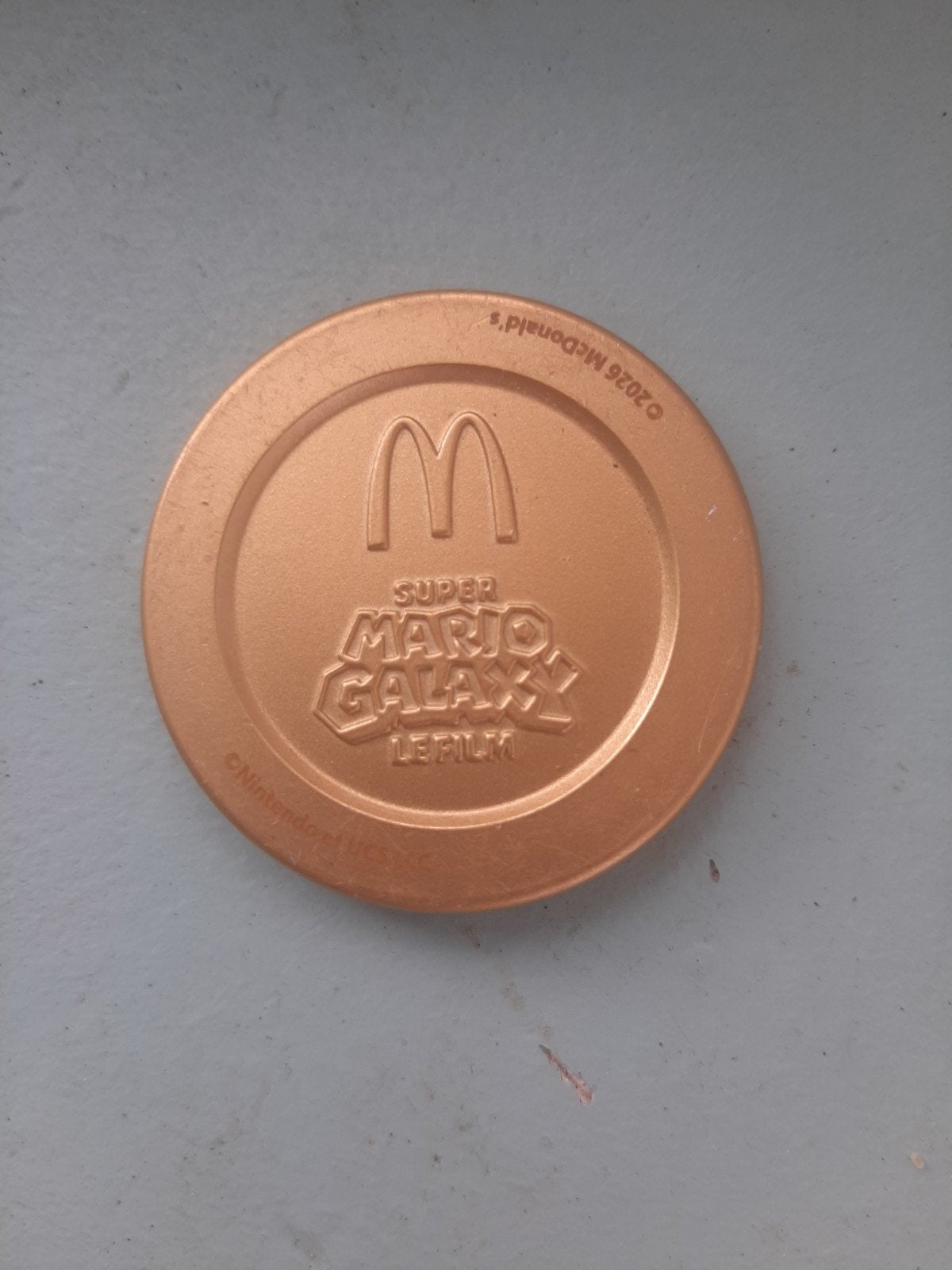 Super Mario Galaxy McDonald's - gouden munt, Ophalen of Verzenden, Zo goed als nieuw