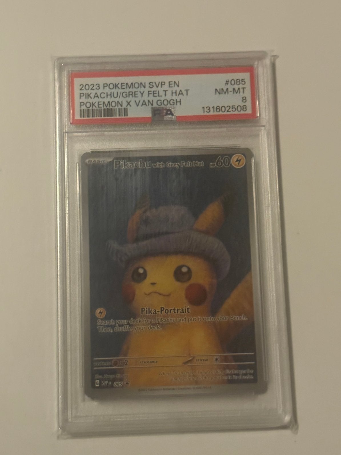 Pikachu with grey felt hat psa 8, Ophalen of Verzenden, Zo goed als nieuw