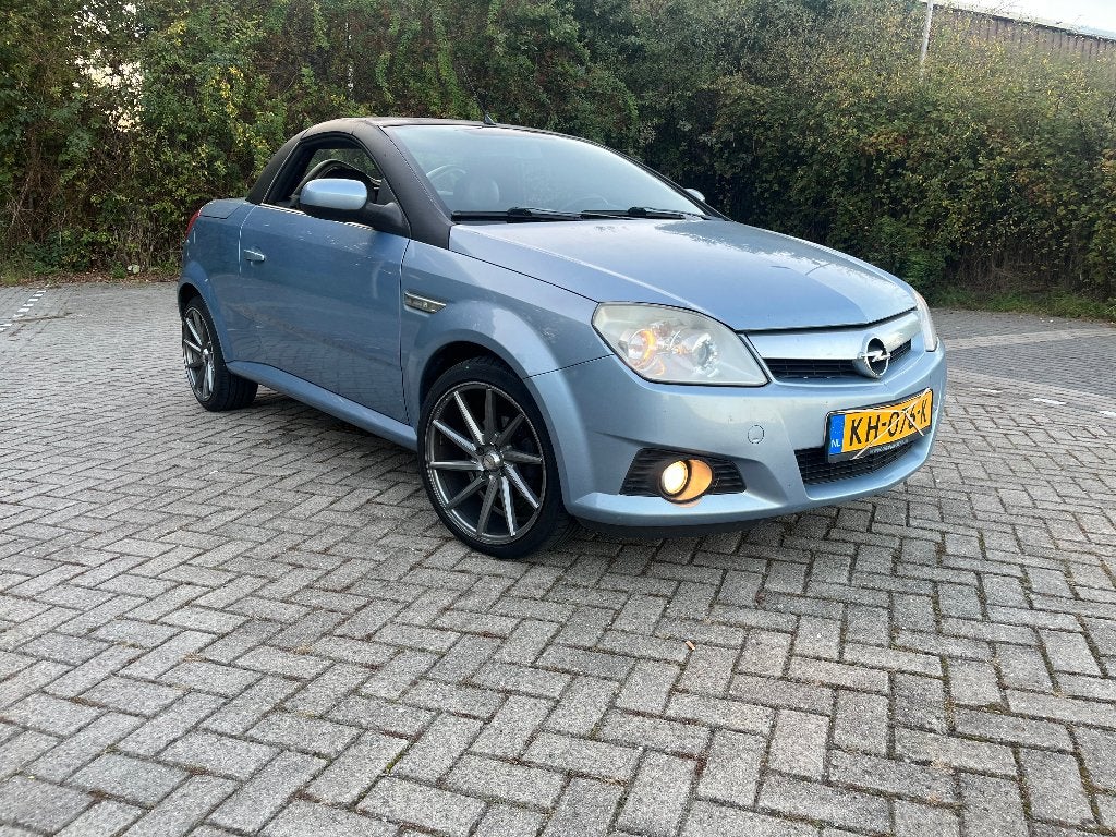 Opel Tigra 1.8 16V Twintop 2005 Blauw, Auto's, Dealer onderhouden, 125 pk, Zwart, 4 cilinders