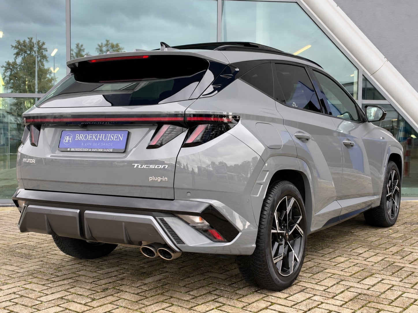 Hyundai Tucson 1.6 T-GDI PHEV N Line Sky 4WD 265pk Panoramad, Auto's, Automaat, Dealer onderhouden, Zwart, 4 cilinders