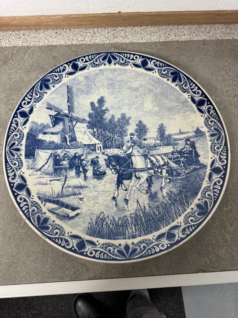 Delfs blauw bord, Ophalen
