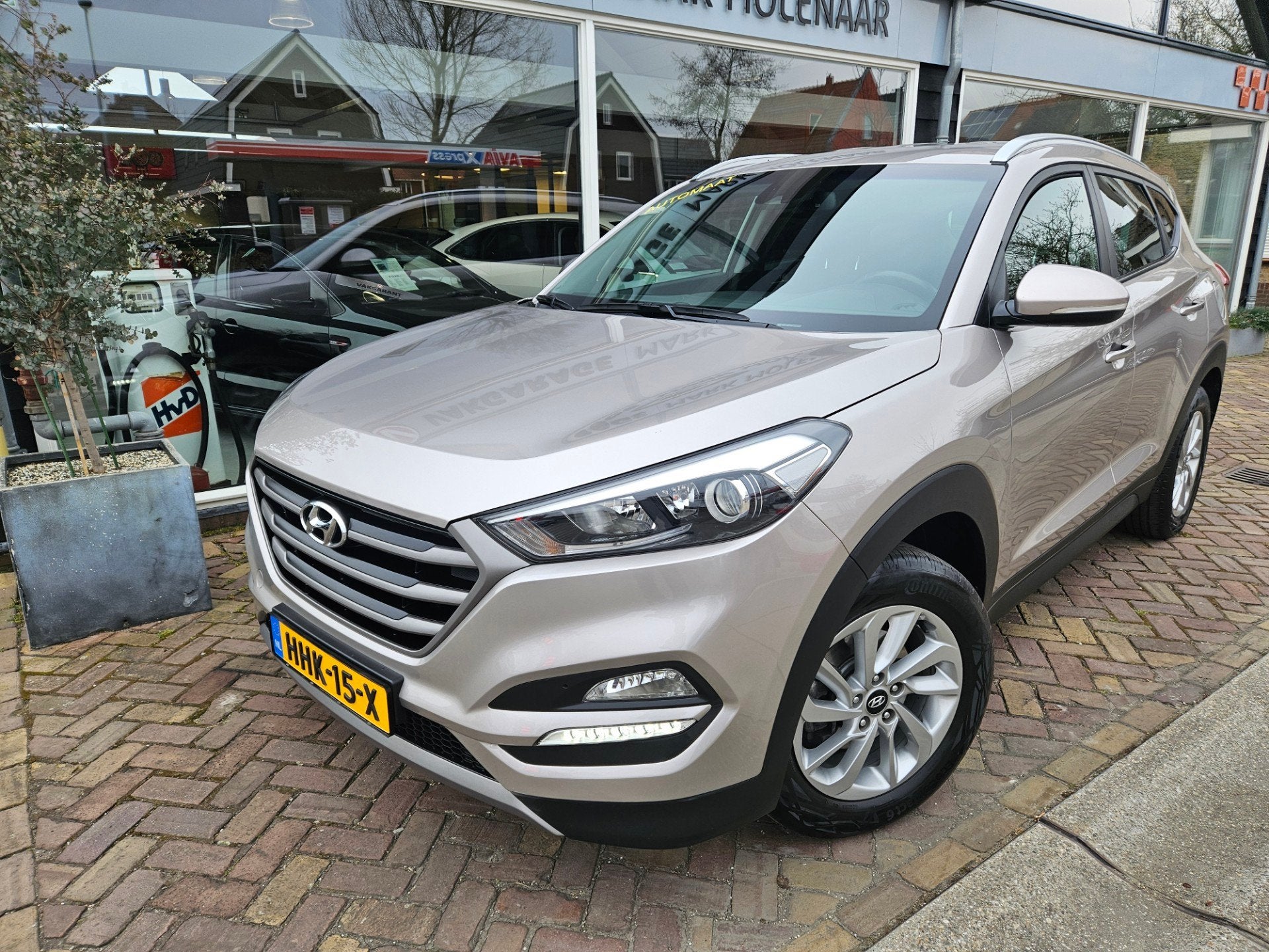 Hyundai TUCSON 1.6 T-GDi i-Motion 4WD,full optionsautomaat, Auto's, Gebruikt, 4 cilinders, Bruin, Bedrijf