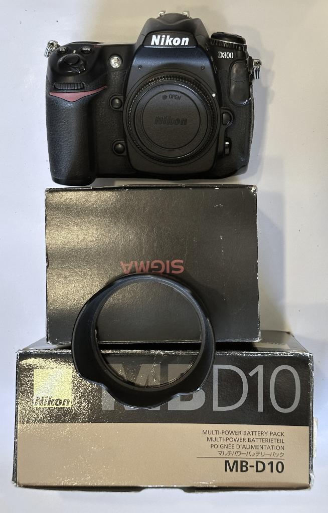 Nikon D300 + MB-D10 grip + Sigma 18-125mm + 3 accu’s set, Audio, Tv en Foto, Fotocamera's Digitaal, Gebruikt, Ophalen of Verzenden