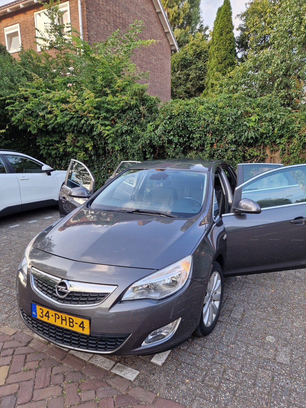 Opel Astra 1.4 Turbo Ecotec 103KW 5-D 2011 Grijs, Auto's, Voorwielaandrijving, Euro 5, 4 cilinders, Leder en Stof