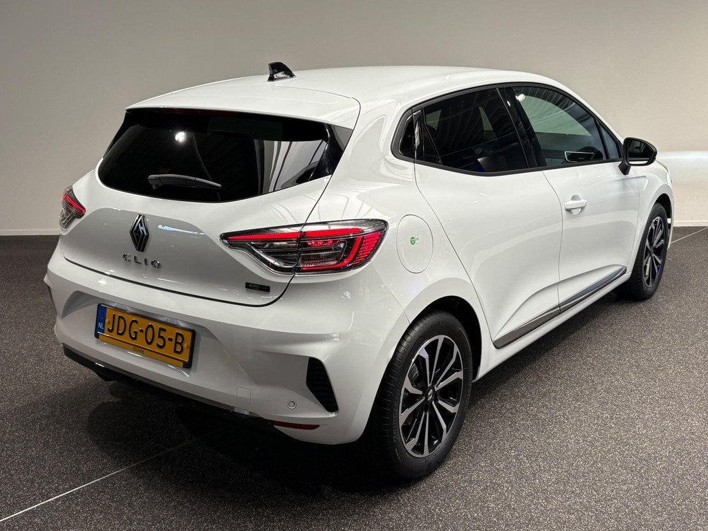 Renault Clio 1.6 E-Tech Full Hybrid 145 techno | Navigatie |, Auto's, Gebruikt, Met garantie (alle), Leder en Stof, Wit