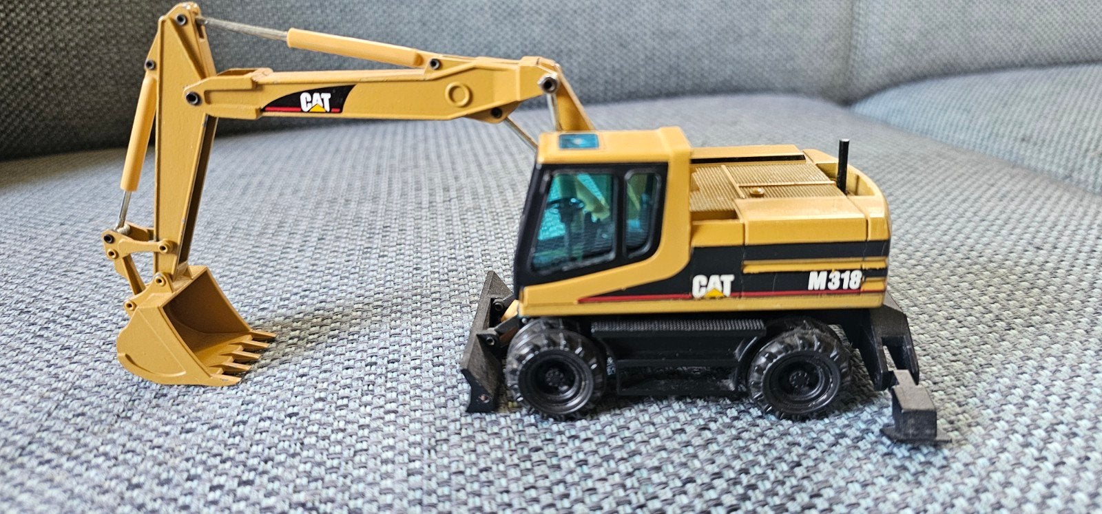 Caterpillar M318 mobiele kraan,NZG, Hobby en Vrije tijd, Ophalen of Verzenden, Zo goed als nieuw, Hijskraan, Tractor of Landbouw