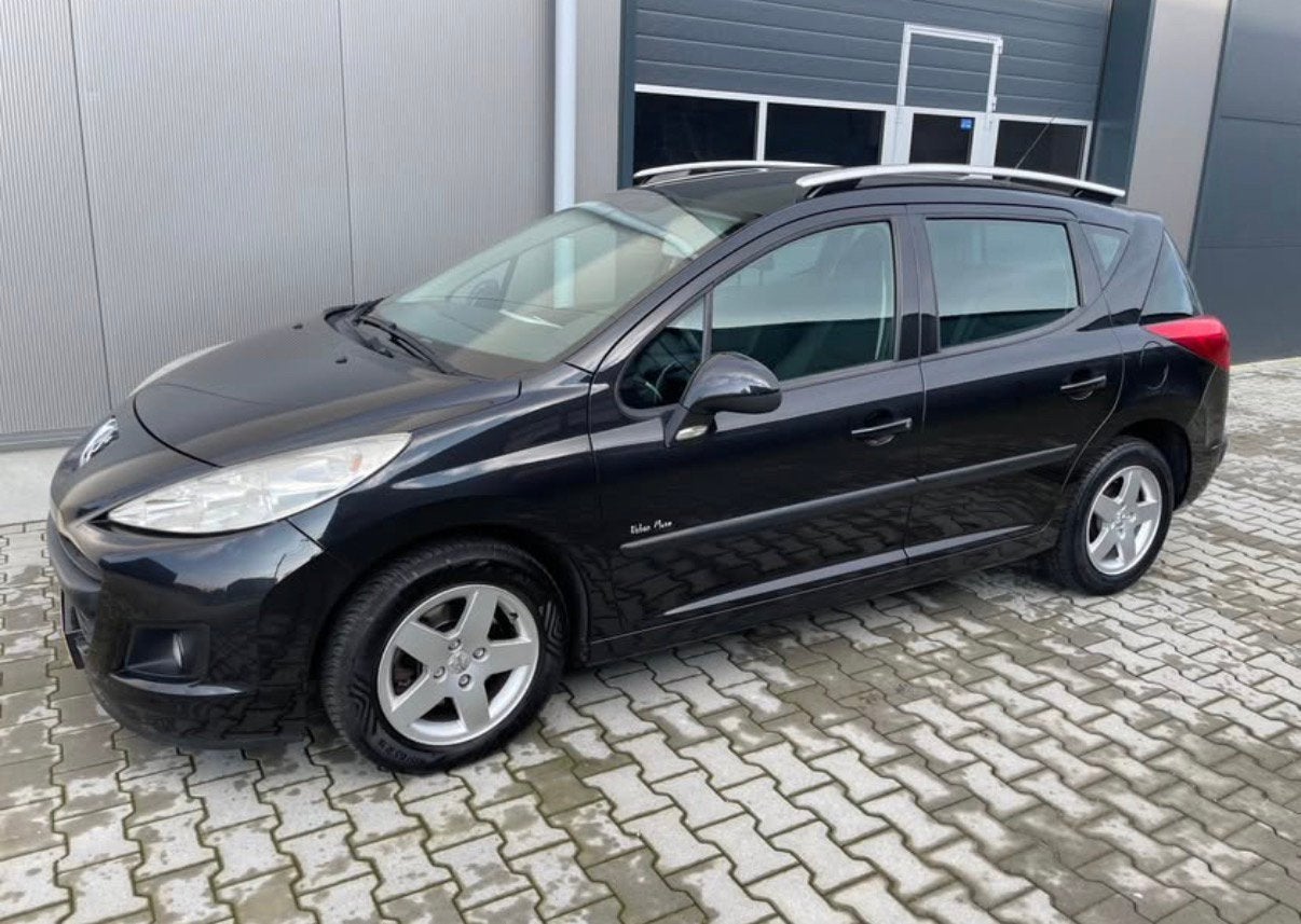 Peugeot 207 1.4 SW X-line 95pk 2010 Zwart, Auto's, Peugeot, Voorwielaandrijving, Stof, Zwart, Handgeschakeld