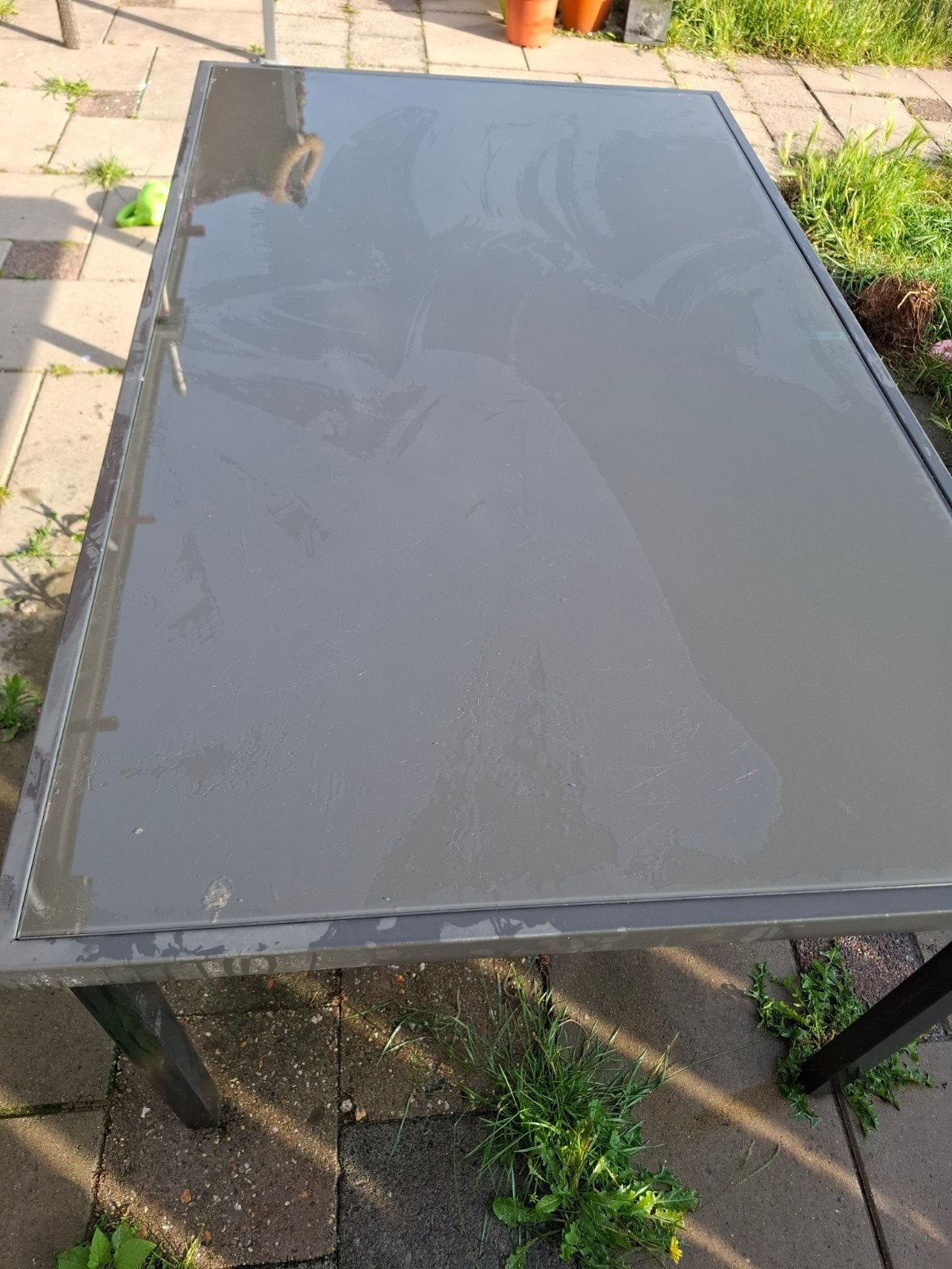 Grote tuintafel met glazen blad, Ophalen
