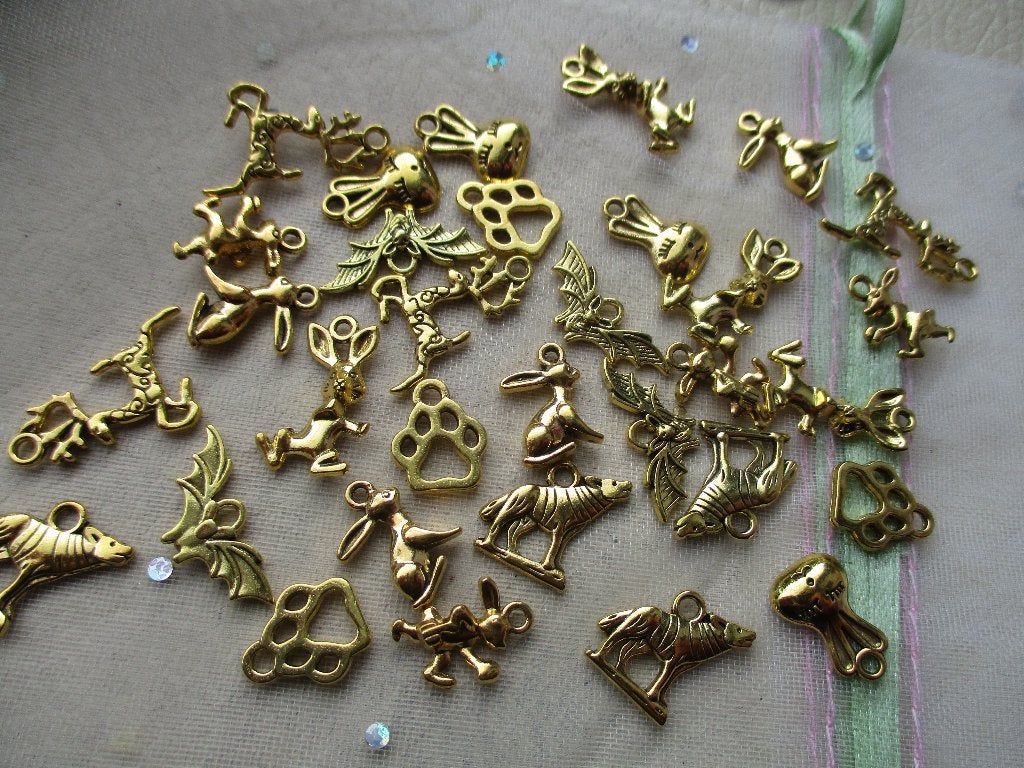 1213/ gold plated tibetiaanse dieren bedels, Ophalen of Verzenden, Nieuw, Bedel