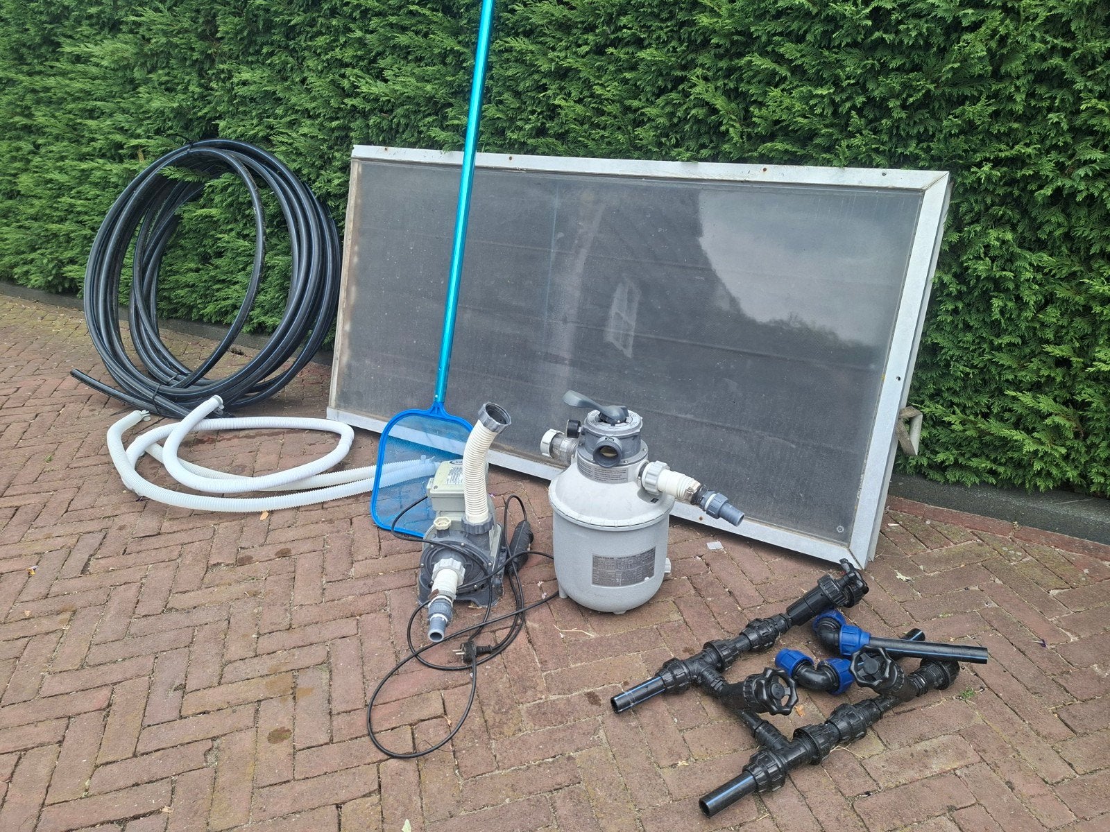 Zandfilter met warmtepaneel., Ophalen