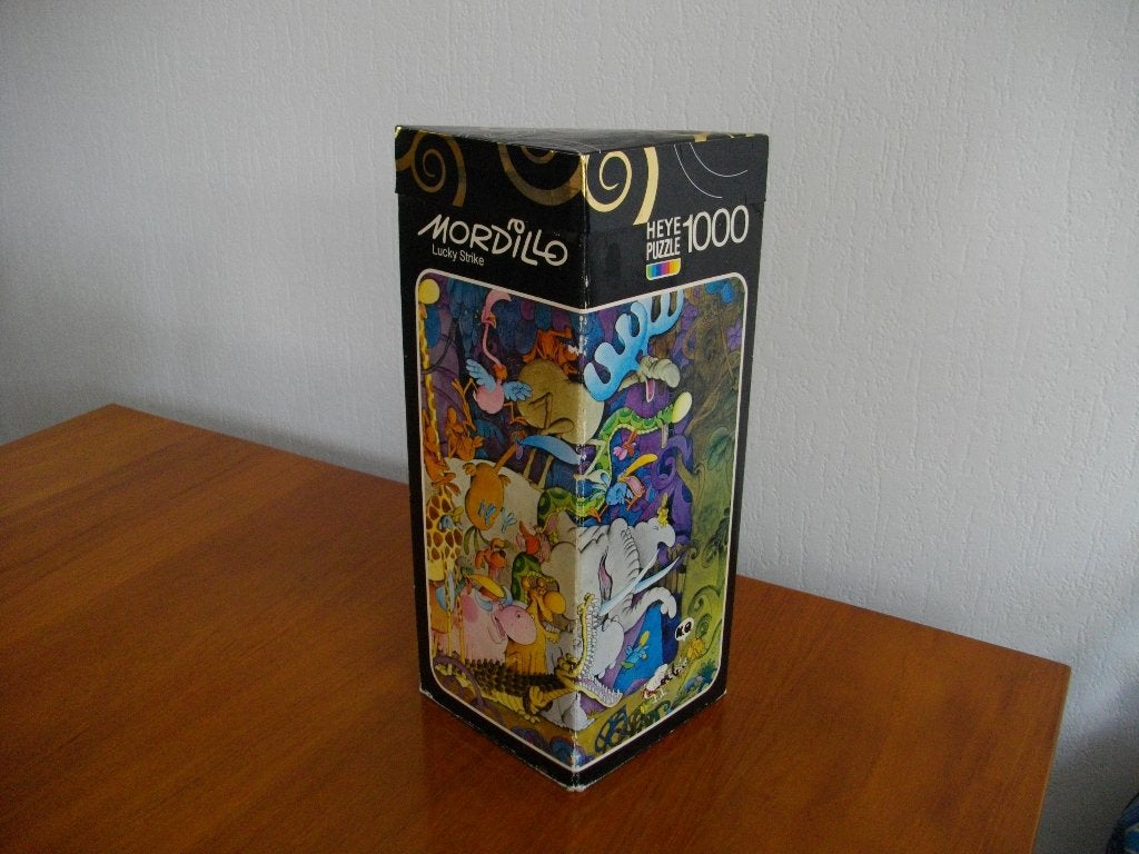 Heye 1000 puzzel - Mordillo - Lucky Strike, Ophalen of Verzenden, 500 t/m 1500 stukjes, Gebruikt, Legpuzzel