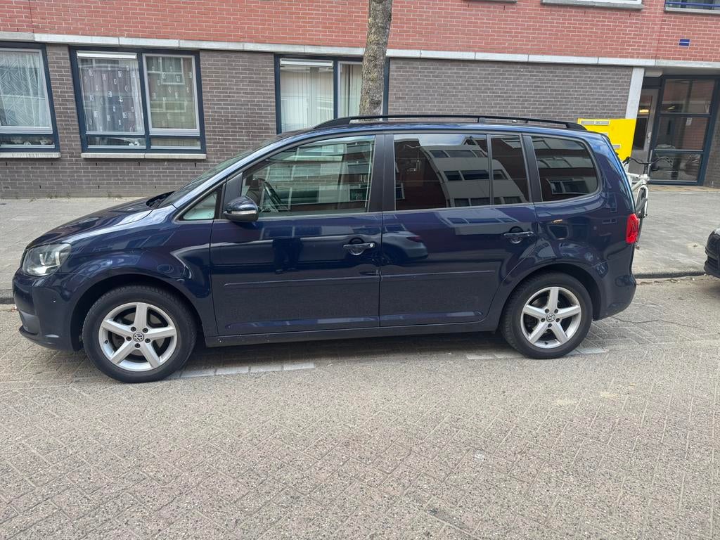 Volkswagen Touran 1.2 TSI 77KW BMT 2011 Blauw, Auto's, Voorwielaandrijving, 4 cilinders, Blauw, 1353 kg