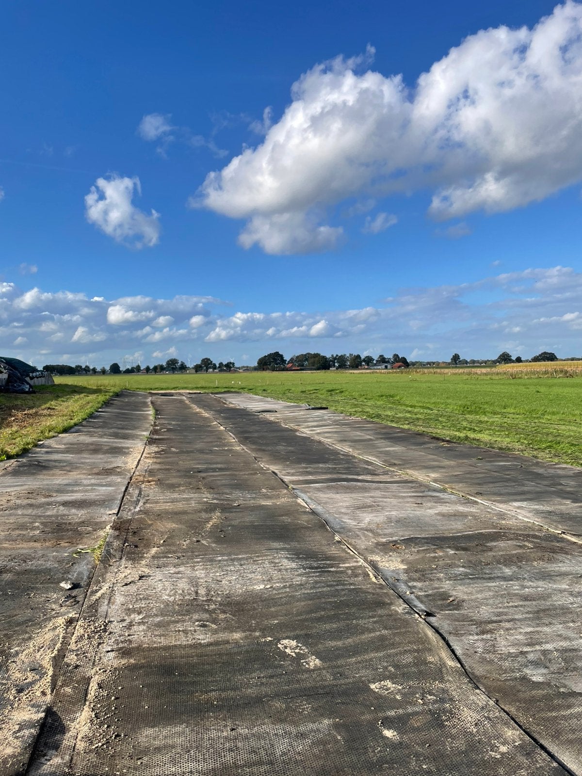 Rubber stalmatten, kuilvoeropslag, wegverharding
