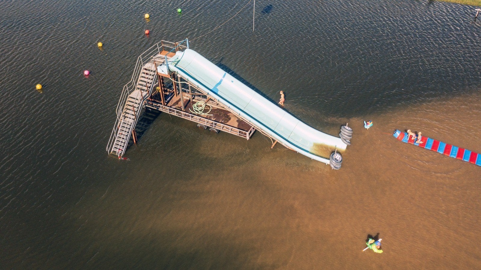 Grote waterglijbaan 12 meter lang - ideaal voor evenementen, Ophalen of Verzenden, Gebruikt, Glijbaan