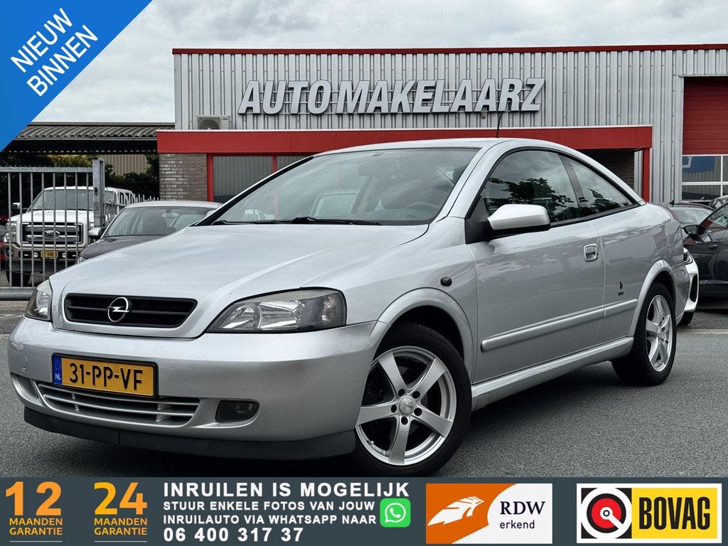 Opel Astra Coupé NAP AUTOMAAT AIRCO 2.2-16V NAP AUTOMAAT AI, Auto's, Stof, Gebruikt, Zwart, 4 cilinders