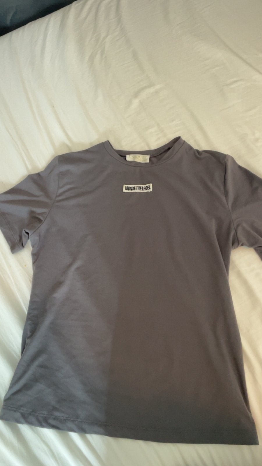 Grijs T-shirt van Unique The Label - Maat S, Ophalen of Verzenden, Zo goed als nieuw, Korte mouw, Maat 36 (S)