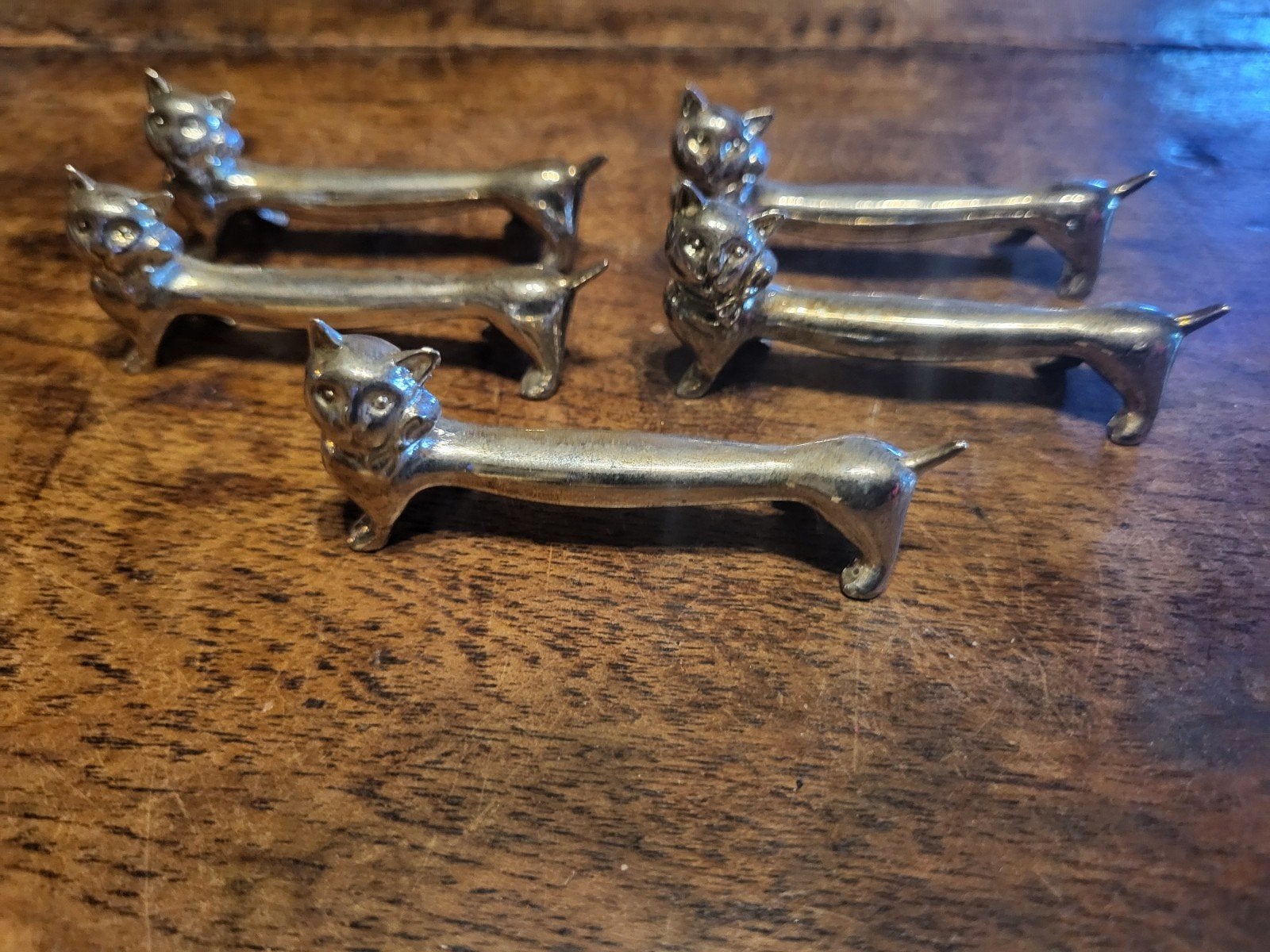 Set van 5 verzilverde messenleggers in de vorm van een poes, Ophalen of Verzenden