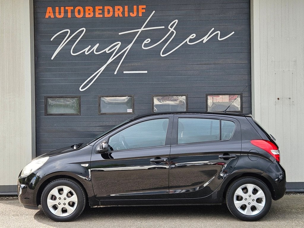 Hyundai I20 1.4i i-Catcher|Pdc achter|Clima|Org NL|, Voorwielaandrijving, Parkeersensor, Zwart, 4 cilinders