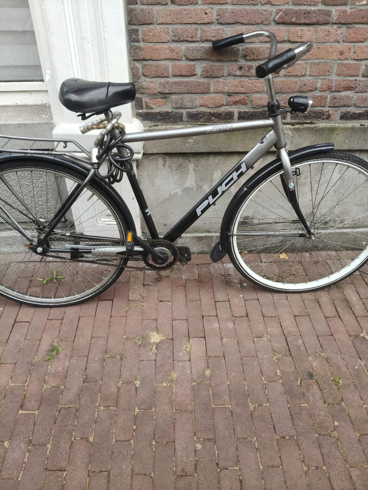mannen fiets grijs, Ophalen, Terugtraprem