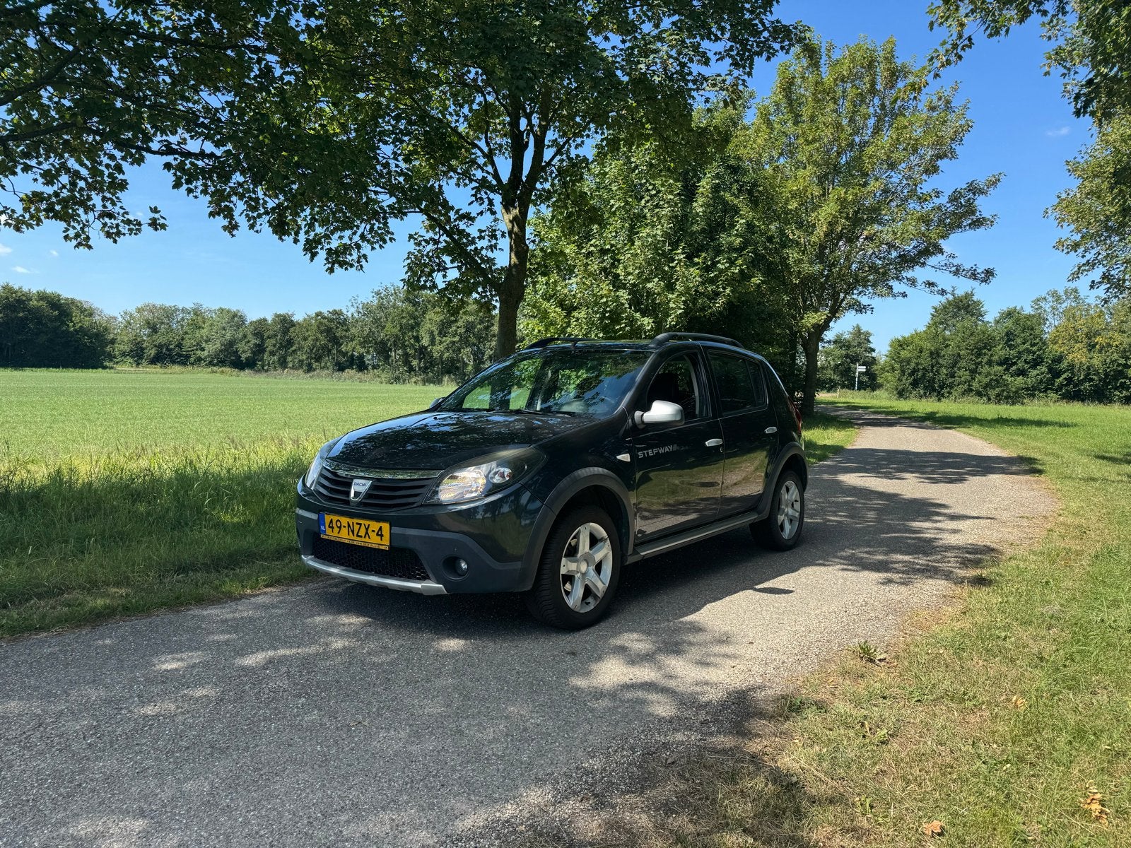 Dacia Sandero 1.6 MPI 90 Stepway 2011 Grijs, Auto's, 40 €/maand, 4 cilinders, 1070 kg, Origineel Nederlands