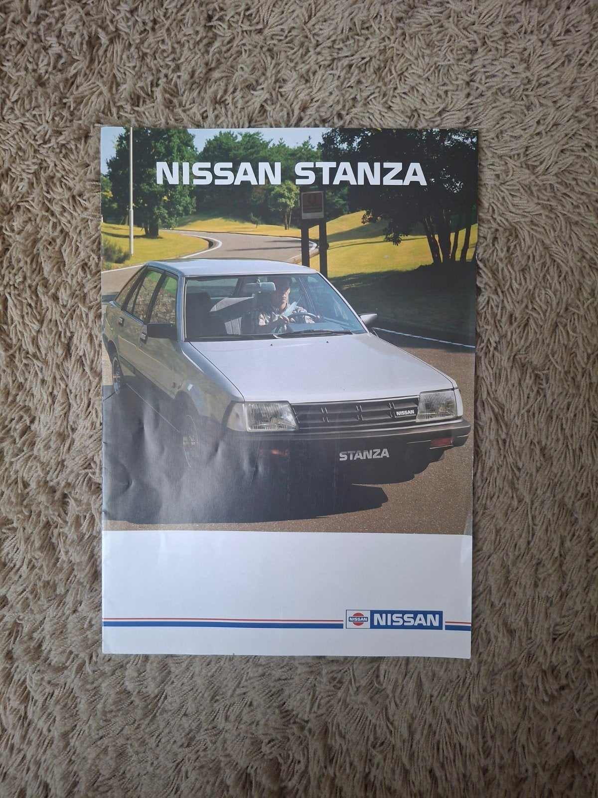 Autofolder Nissan Stanza, Verzenden, Zo goed als nieuw, Nissan