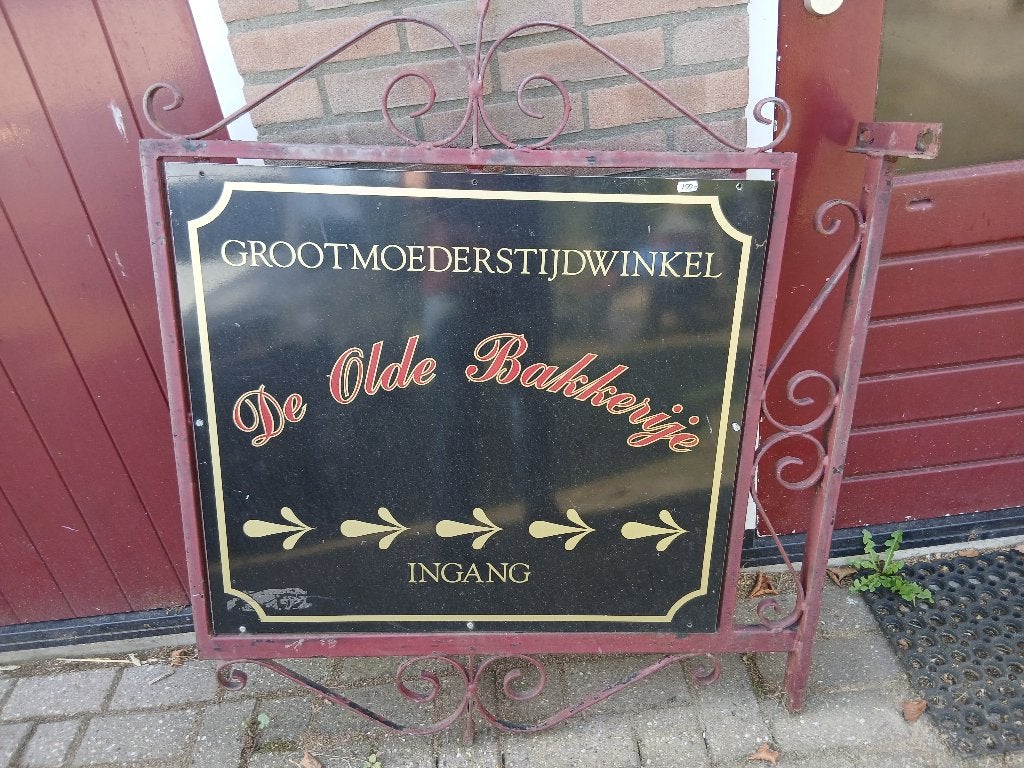 Groot antiek gietijzeren uithangbord naambord voor winkel, Ophalen