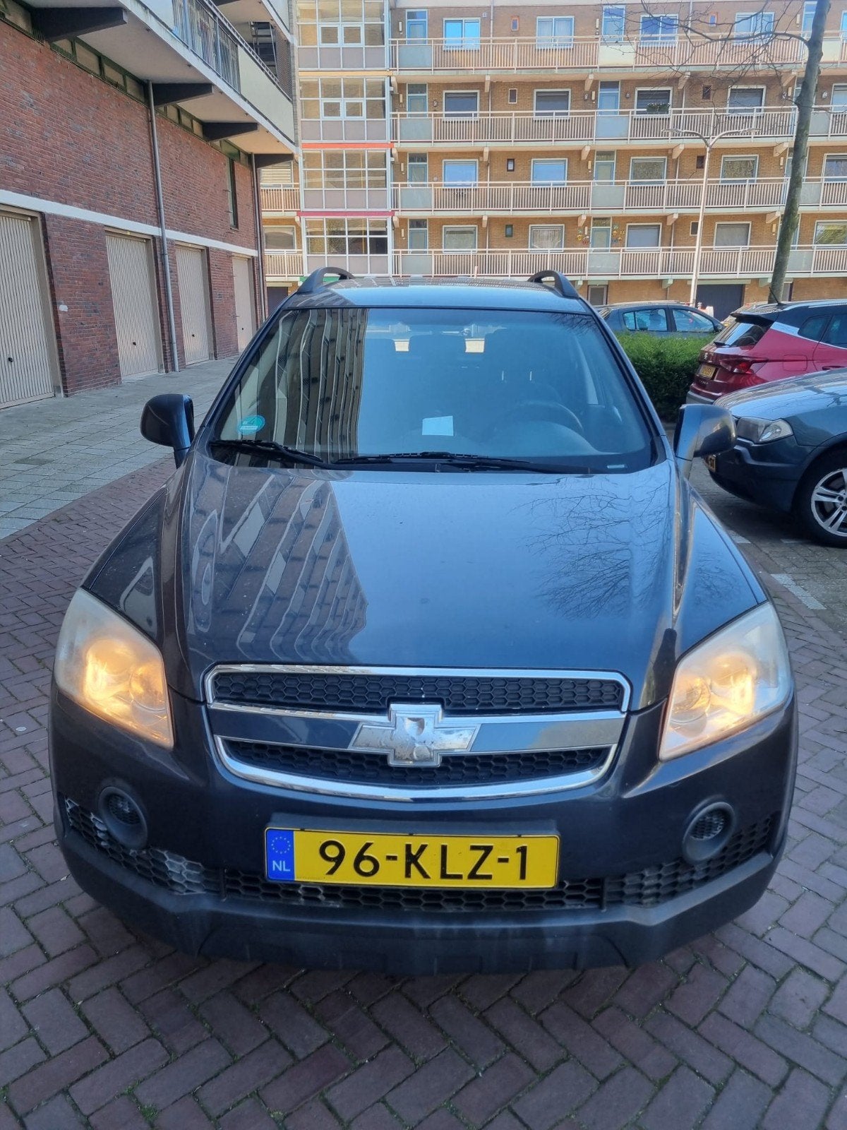 Chevrolet Captiva 2.4 2WD 2010 Grijs, Auto's, Chevrolet, 136 pk, 4 cilinders, 7 stoelen, Handgeschakeld